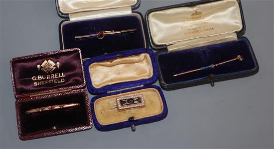 A Victorian, yellow metal, seed pearl and enamel small brooch, two gem set bar brooches including 9ct and one other pin.